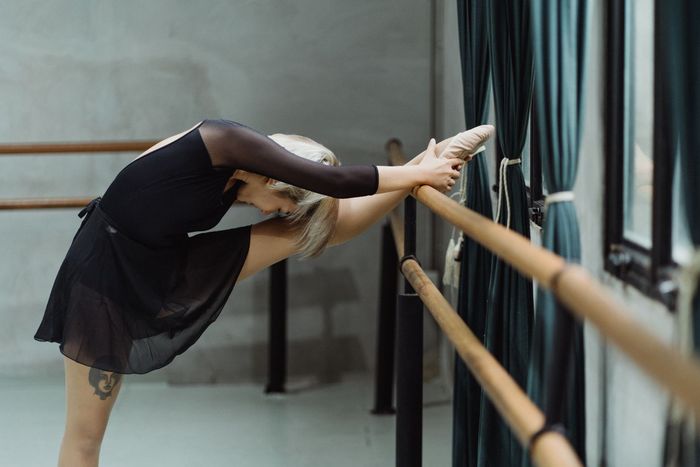 Woman Stretching Her Legs — Dance Studio In Berrimah, NT