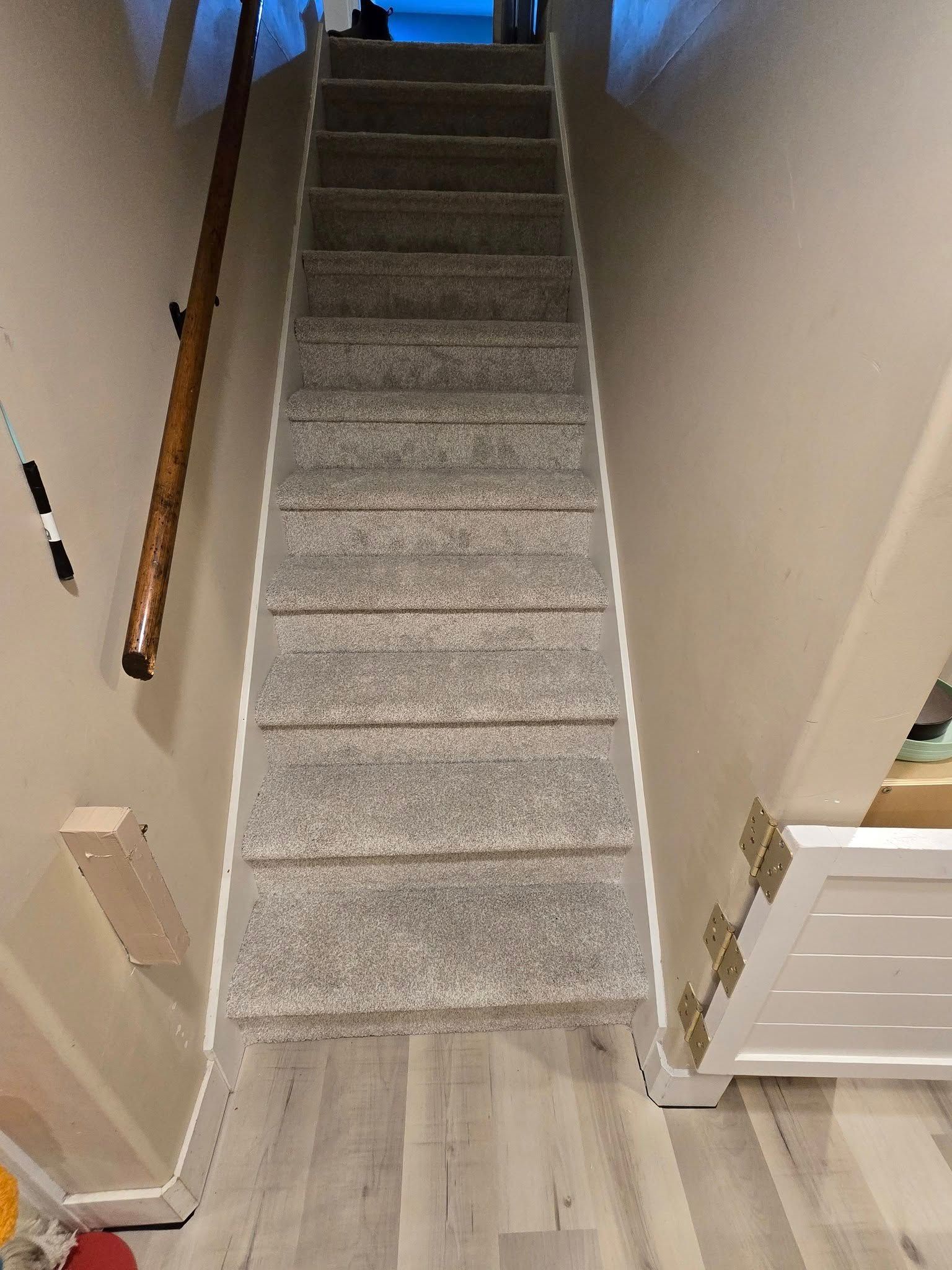 A set of stairs leading up to the second floor of a house.