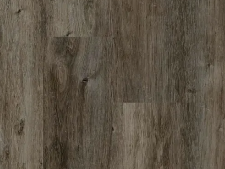 Close-up of weathered gray-brown wood flooring with visible grain patterns and knots.