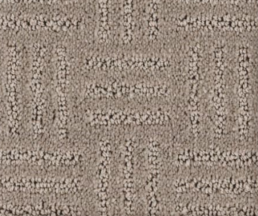 Tan patterned carpet with geometric design.