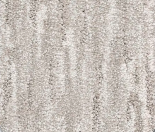 Close-up view of textured, light beige carpet with vertical ribbing.