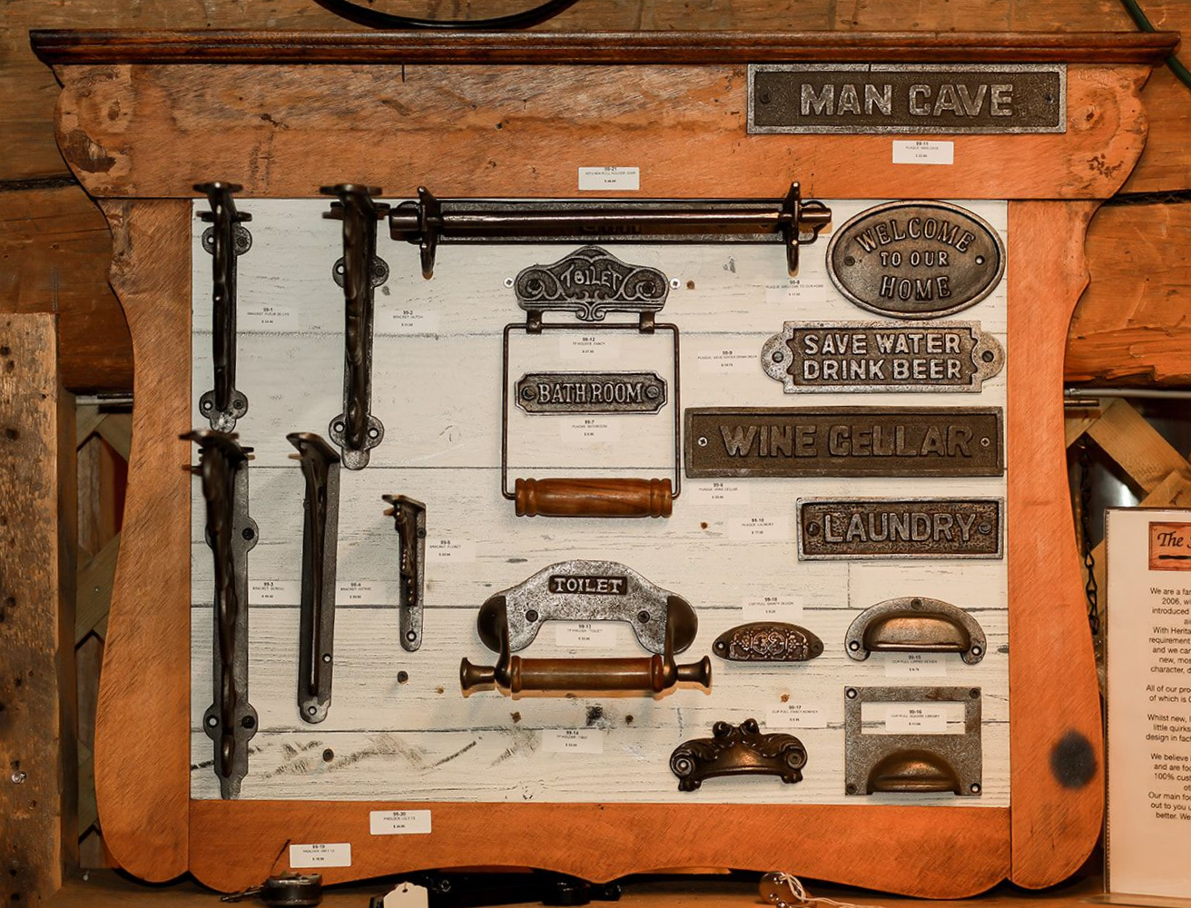 Vintage tool display board with rusted metal parts mounted on a brown wooden panel
