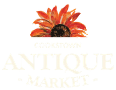 Cookstown Antique Market logo with a red-orange flower above gold text