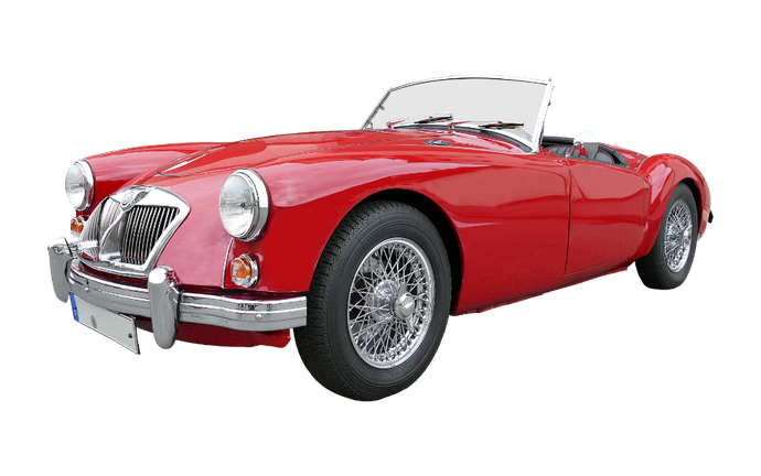 Red convertible sports car with chrome details.