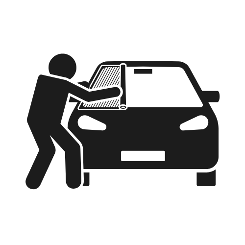Person applying tint to a car's window.