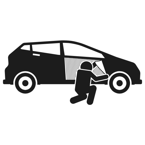 Person breaking into a car, attempting to open the window.