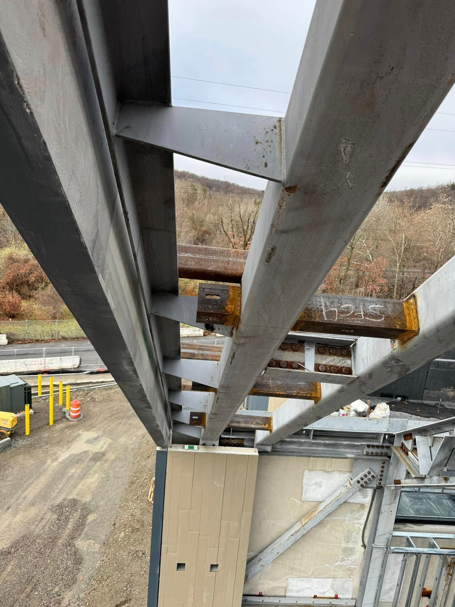 A close up of a metal structure on a construction site.