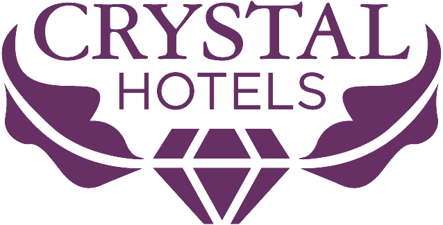 a purple logo for crystal hotels with a diamond in the middle .
