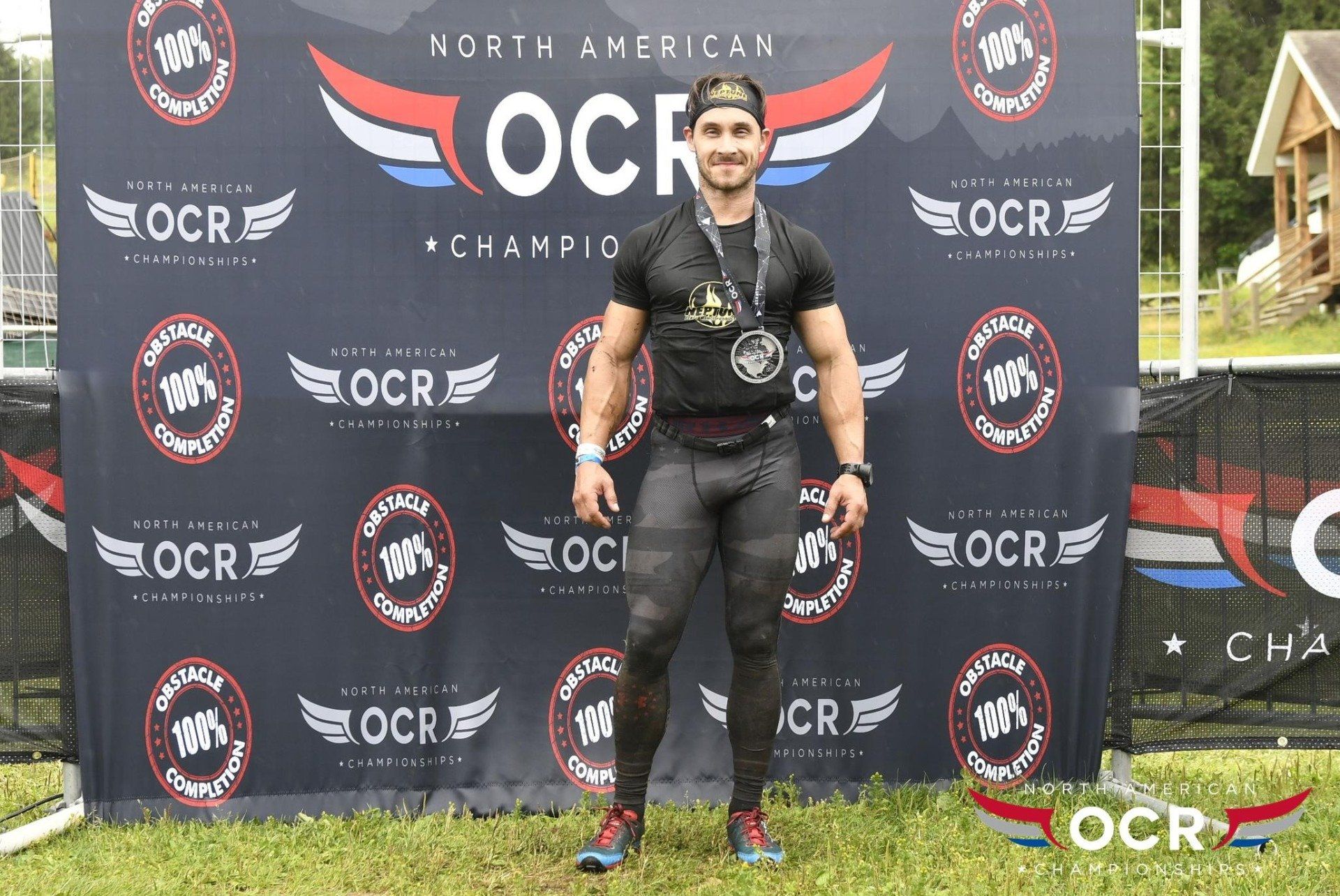A man is standing in front of a banner that says north american ocr