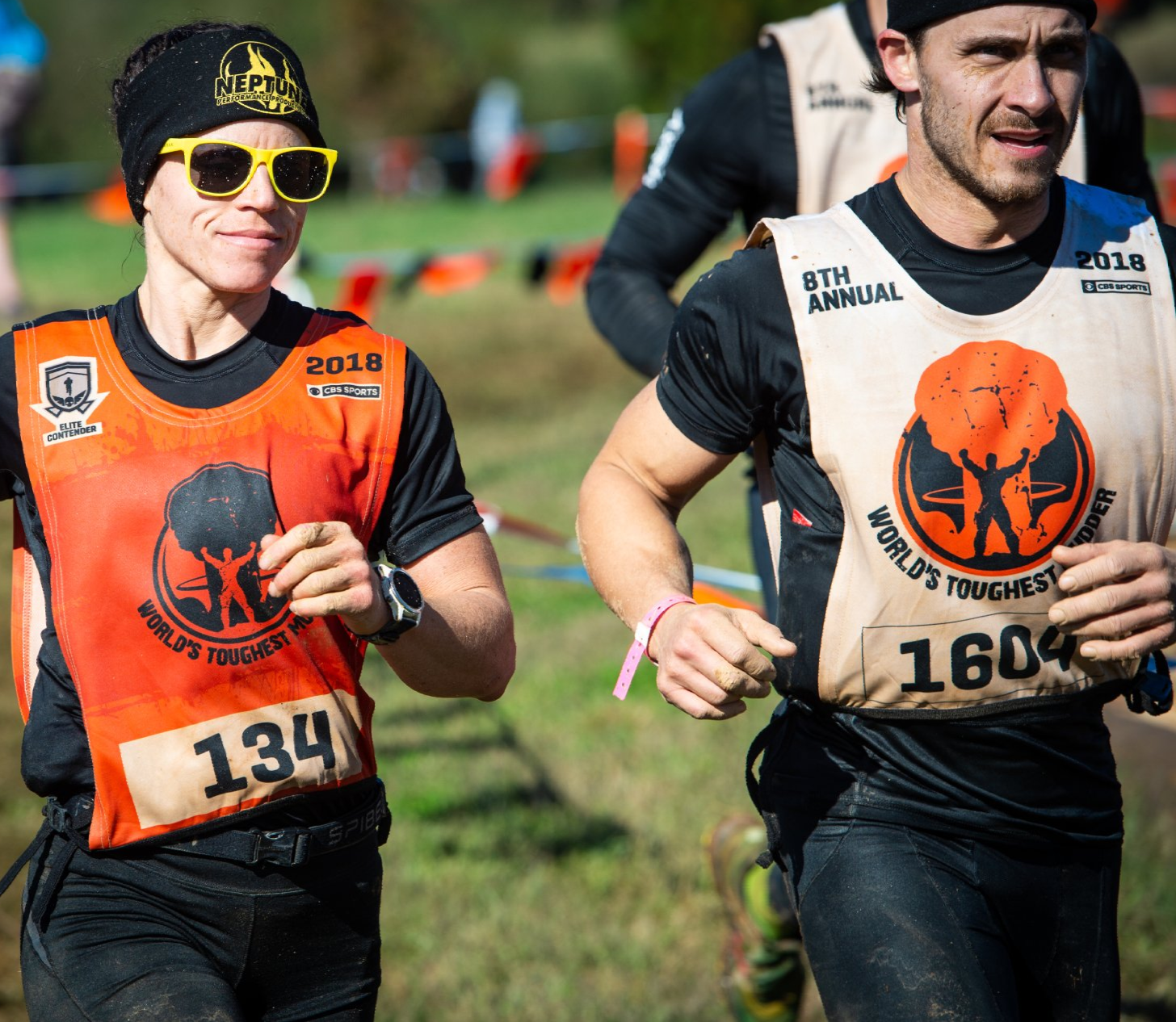 A man and a woman are running in a race.