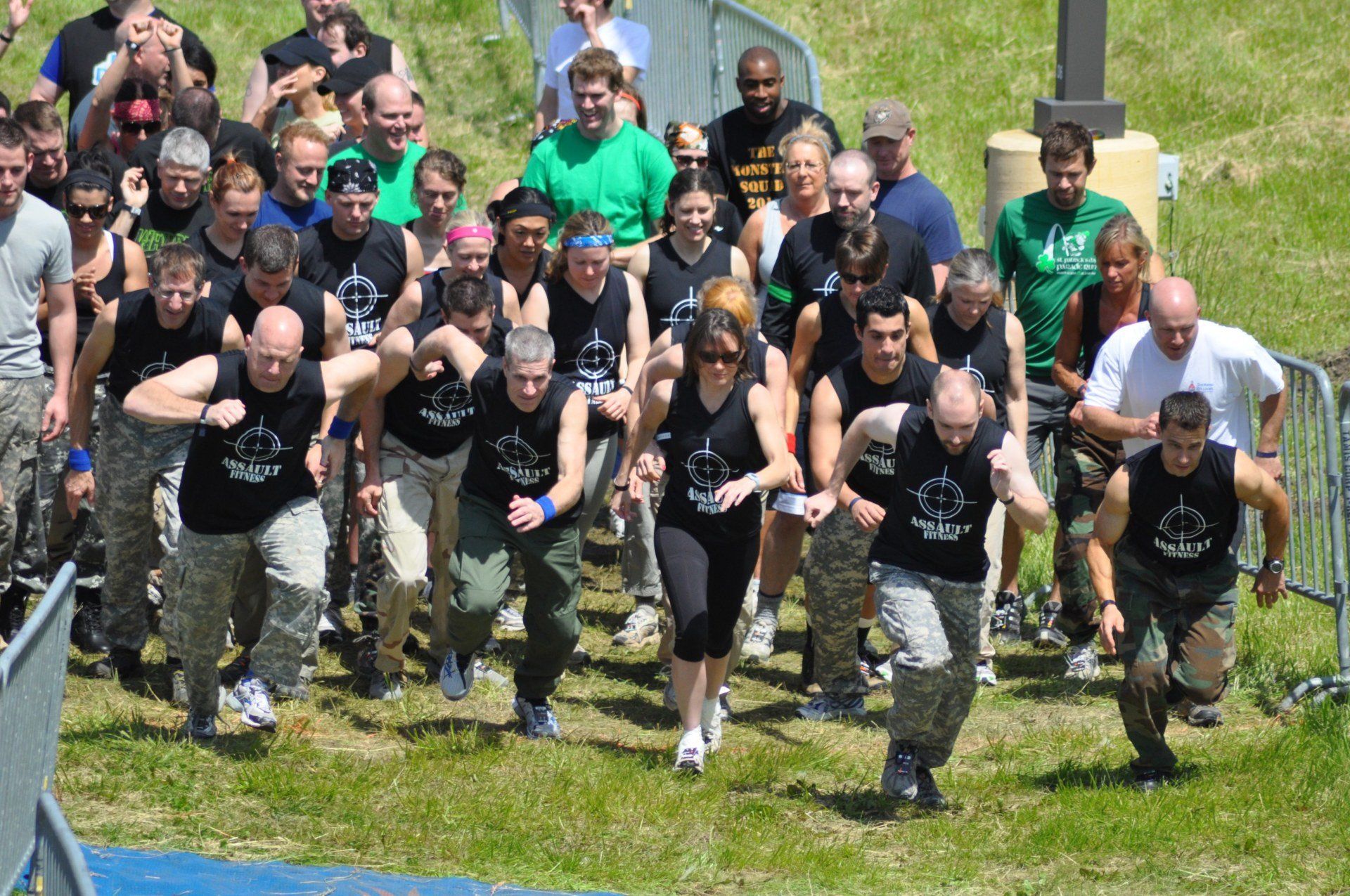 A large group of people are running in a field