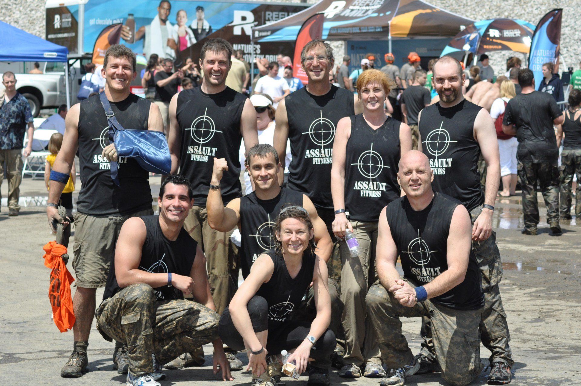 A group of people posing for a picture with a target on their shirts