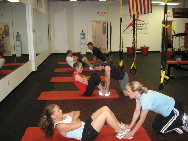 A group of people doing exercises in a gym
