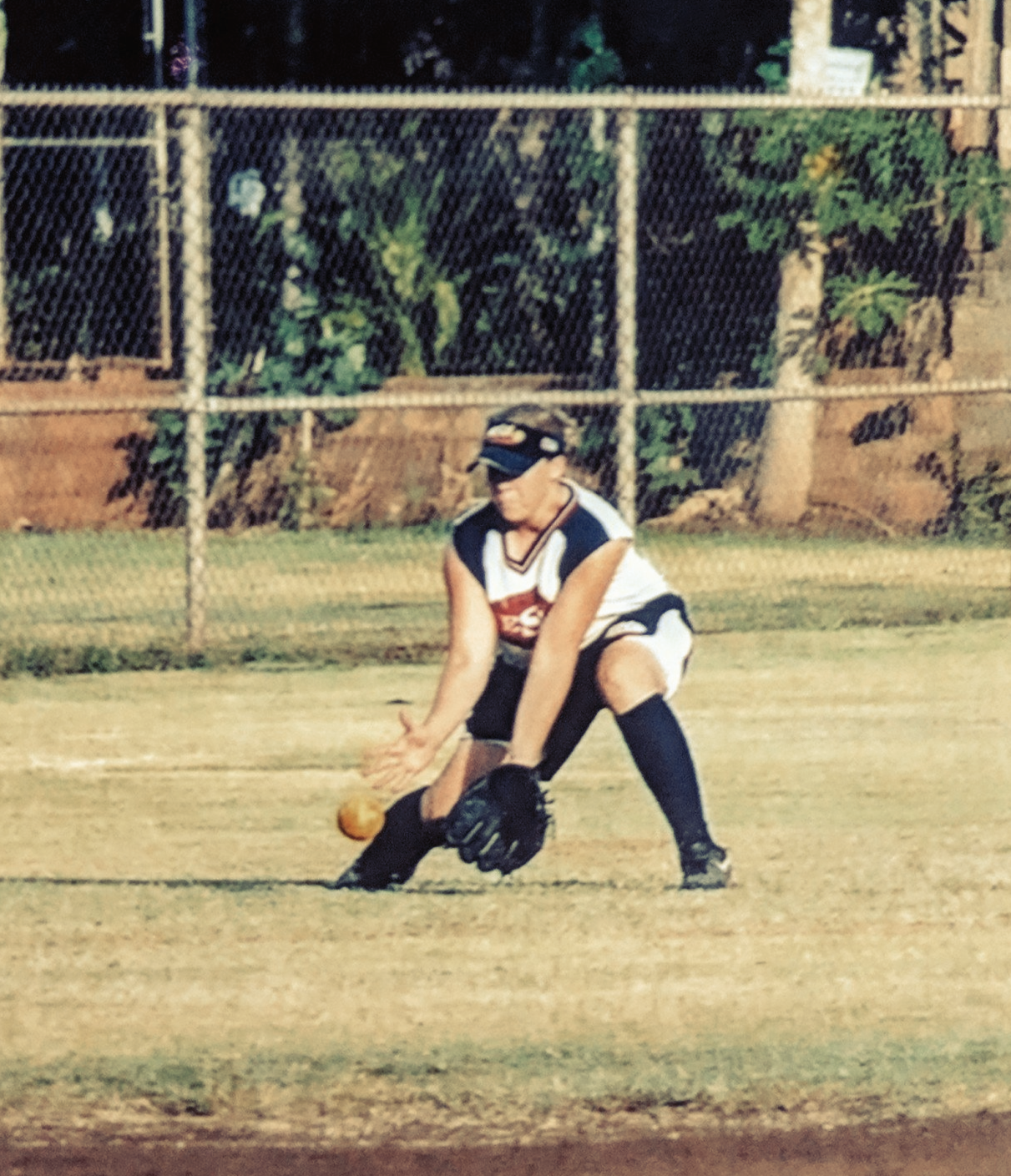 A baseball player wearing a jersey that says ' texas ' on it