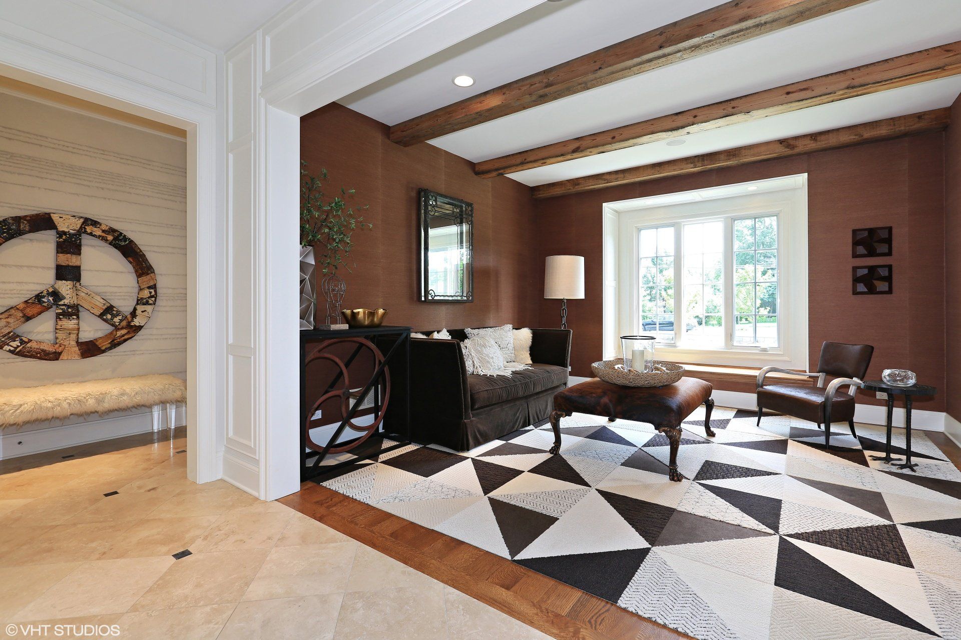 A living room with a peace sign on the wall