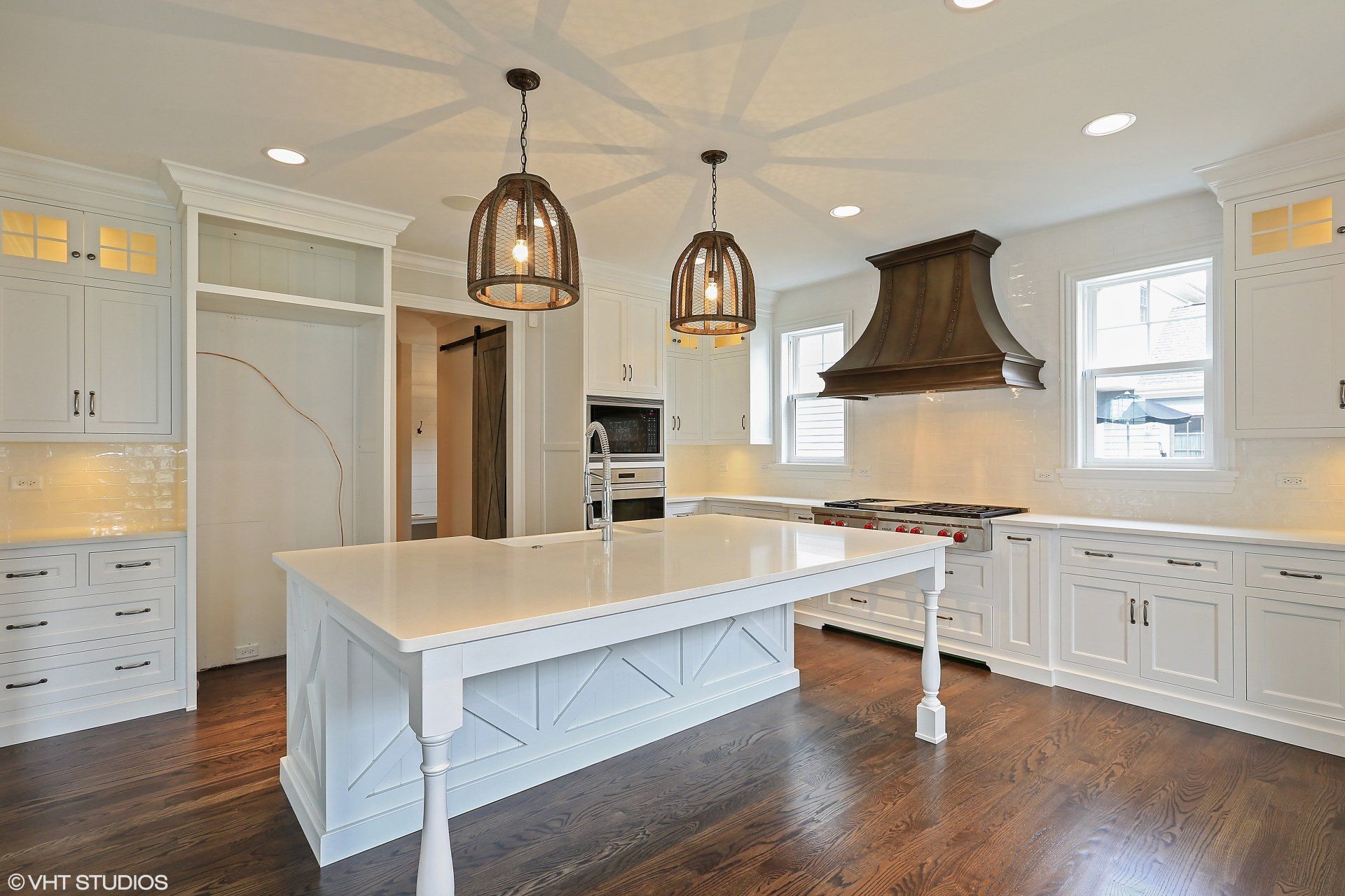 There is a large island in the middle of the kitchen.