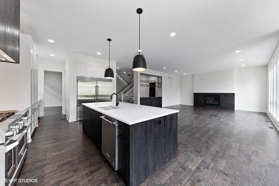 There is a large island in the middle of the kitchen.