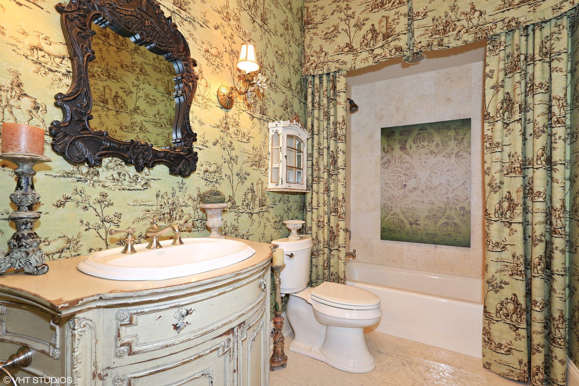 A bathroom with a toilet a sink and a mirror