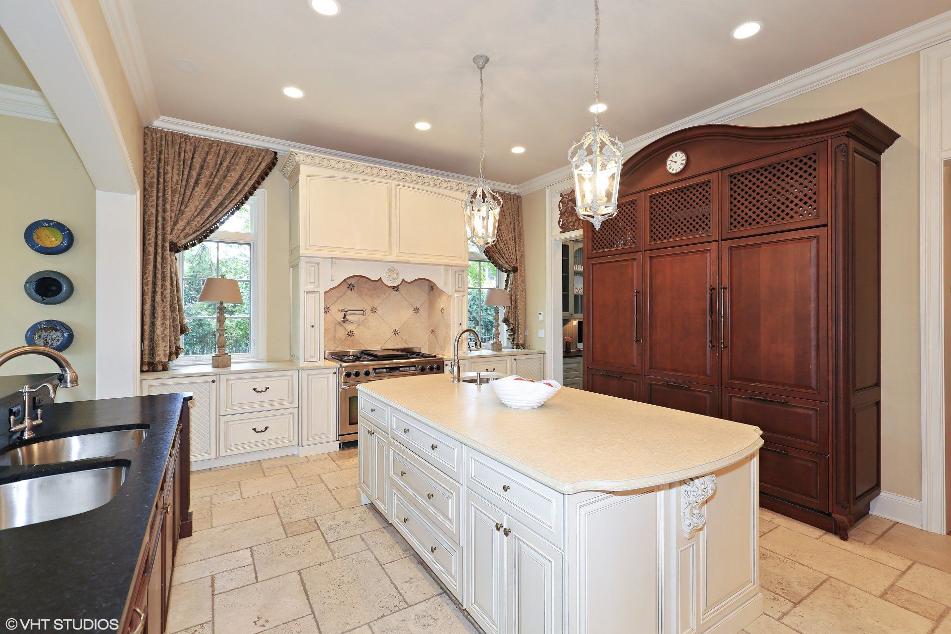There is a large island in the middle of the kitchen.