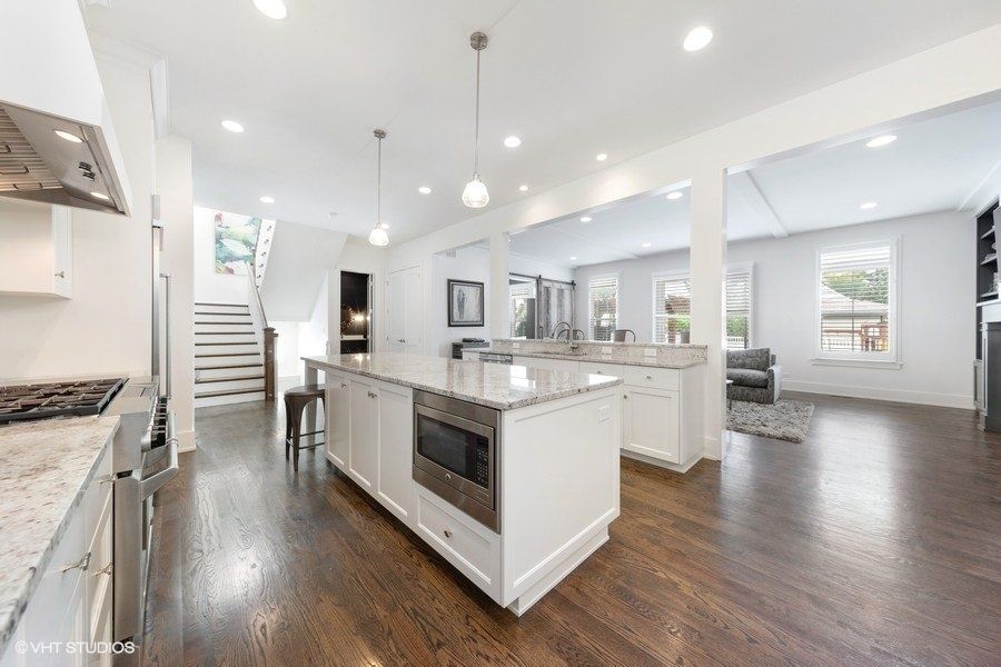 There is a large island in the middle of the kitchen.