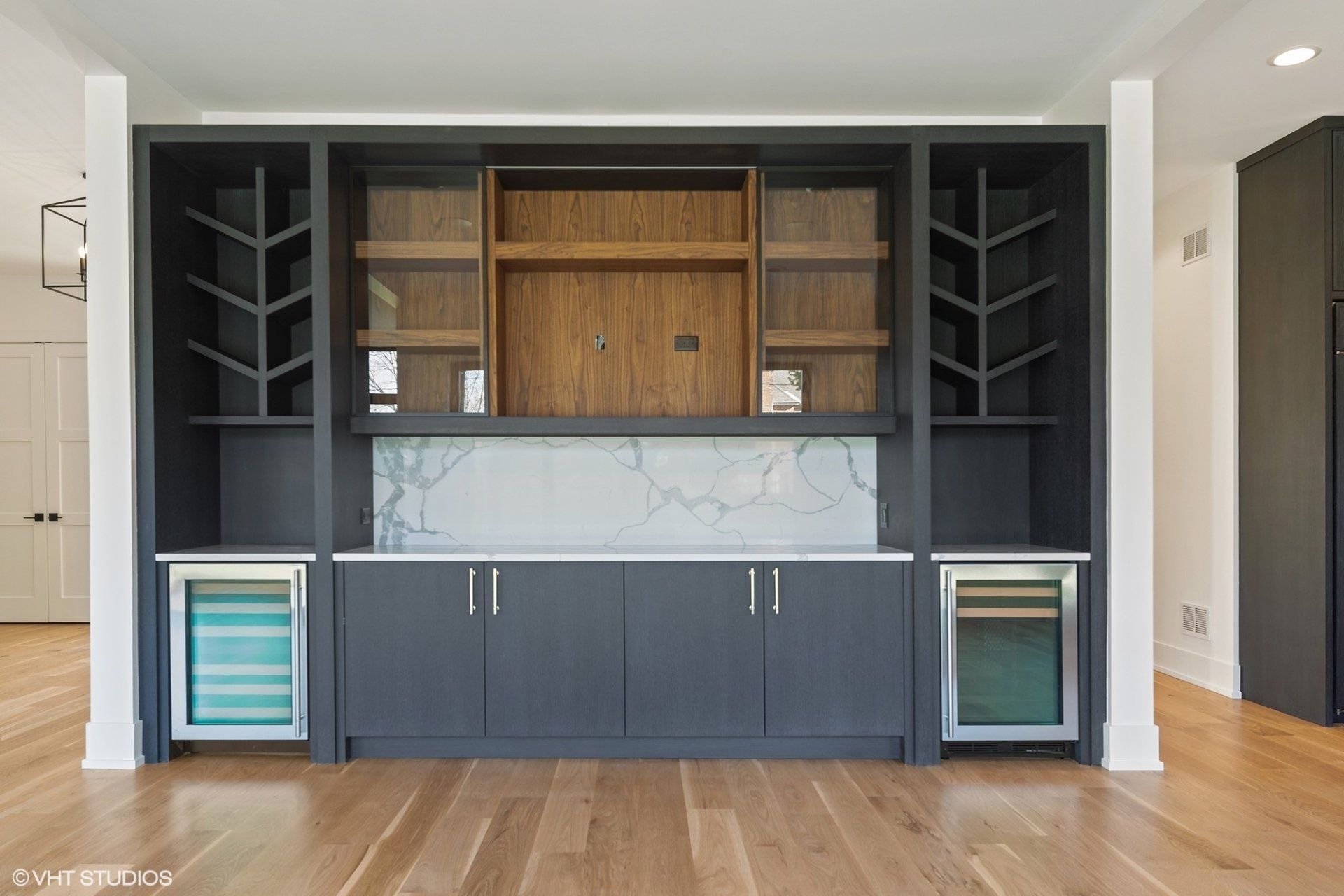 There is a bar in the middle of the room.