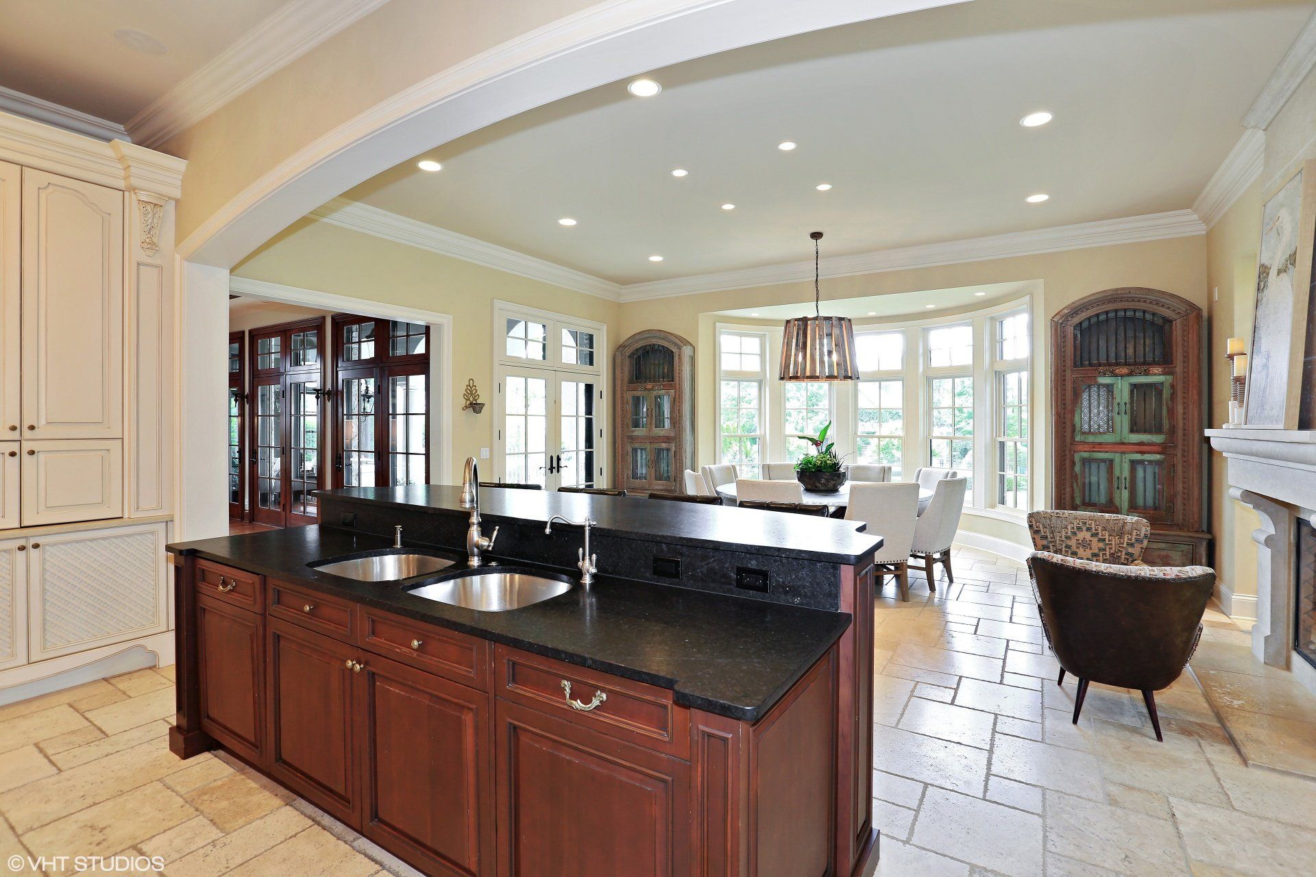 A kitchen with a large island and two sinks