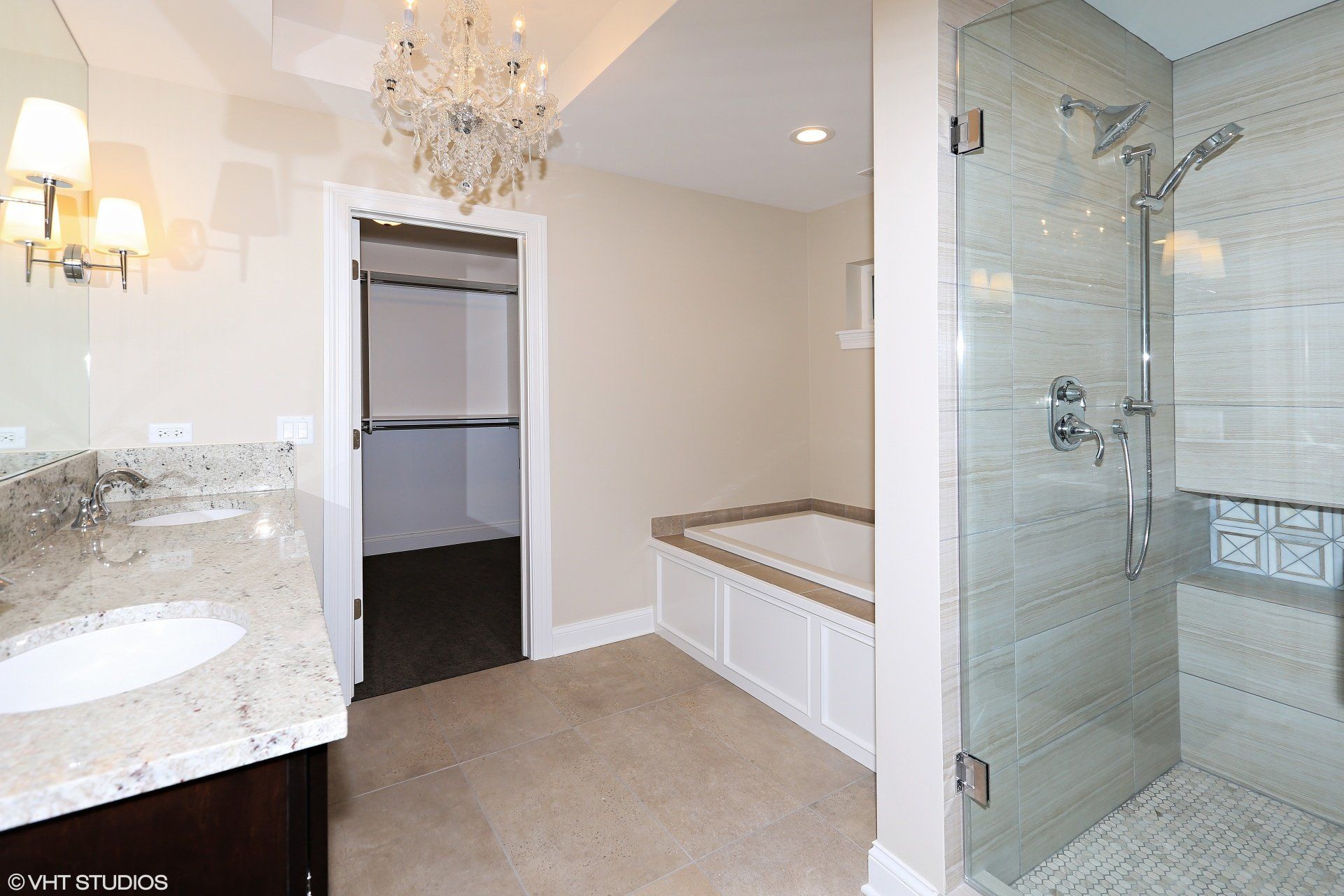 A bathroom with a walk in shower and a bathtub.