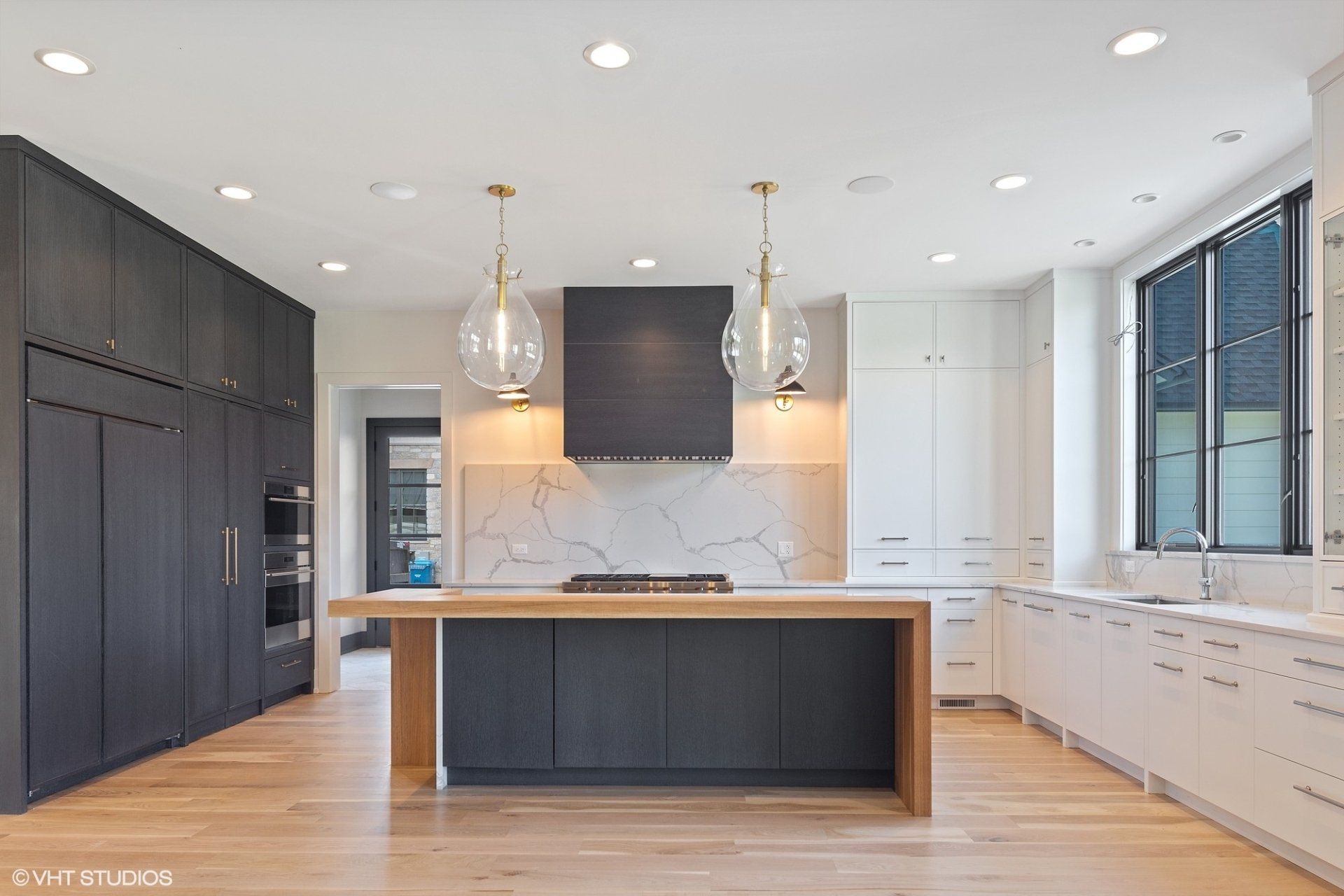 There is a large island in the middle of the kitchen.