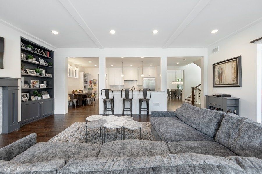 A living room with a couch and a table in it