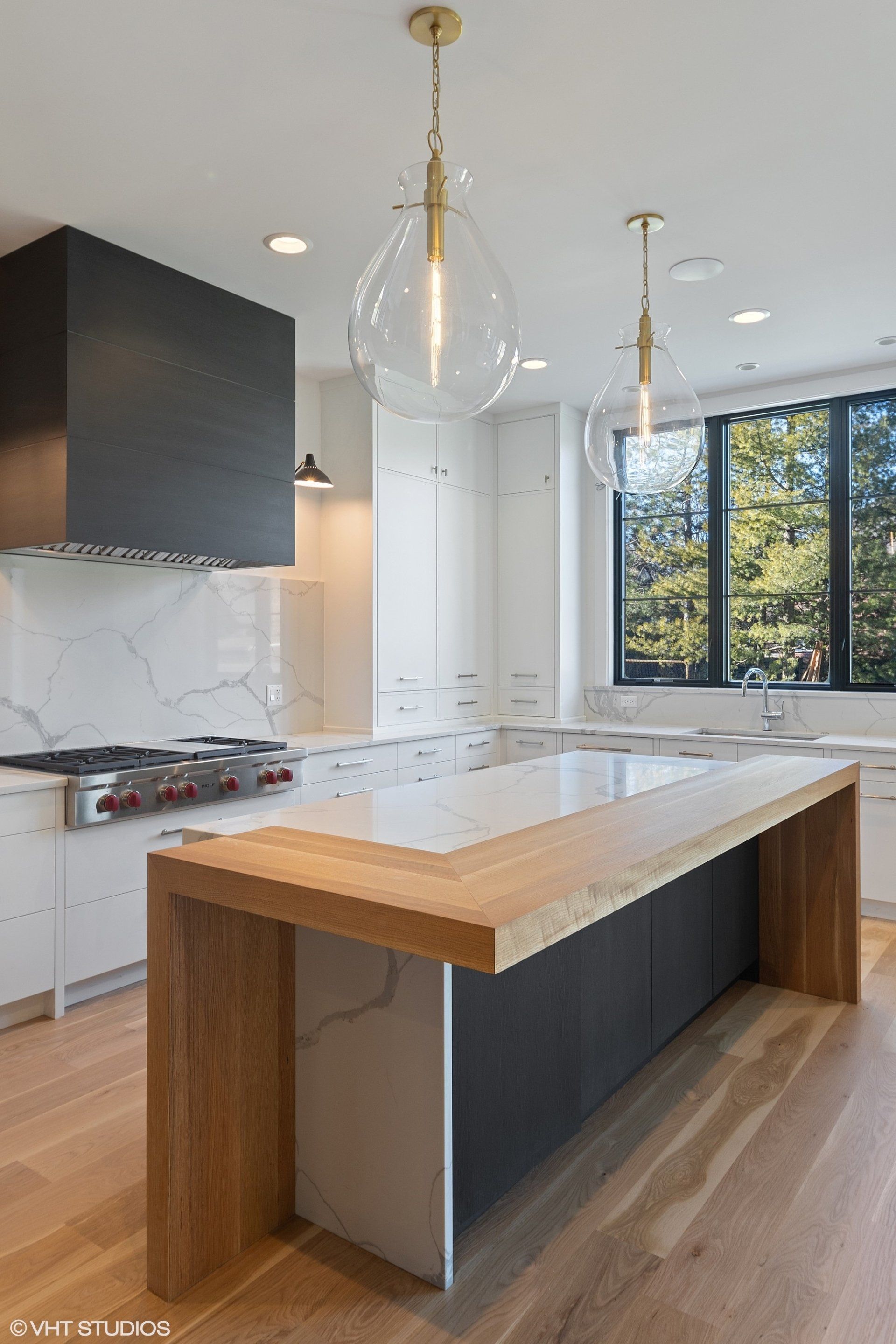There is a large island in the middle of the kitchen.