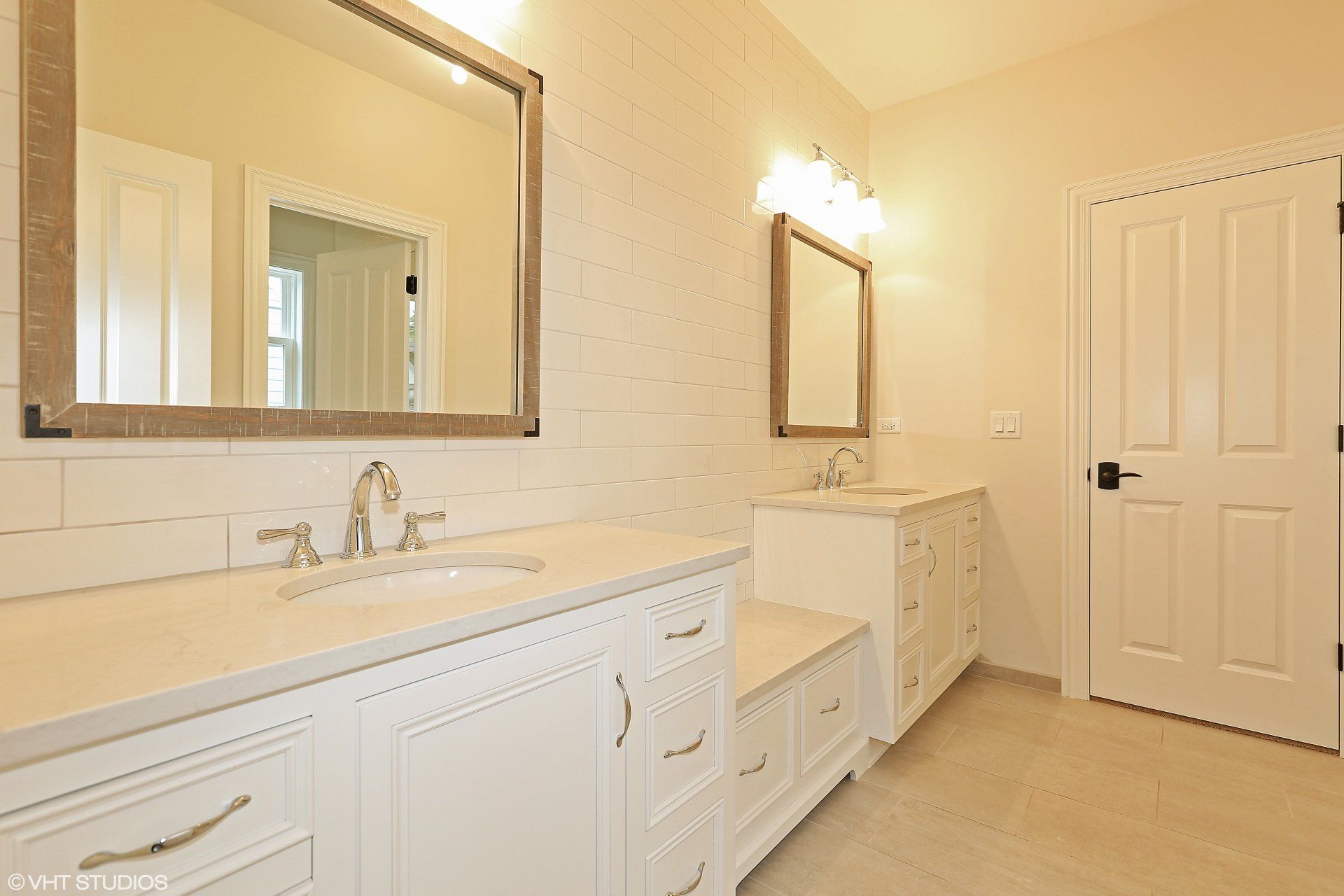 A bathroom with two sinks and two mirrors.