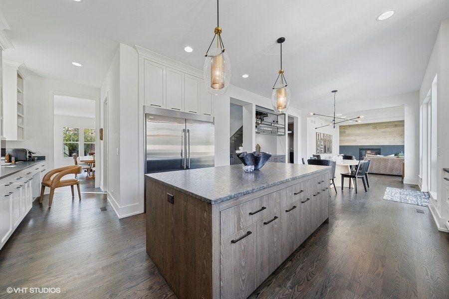 There is a large island in the middle of the kitchen.