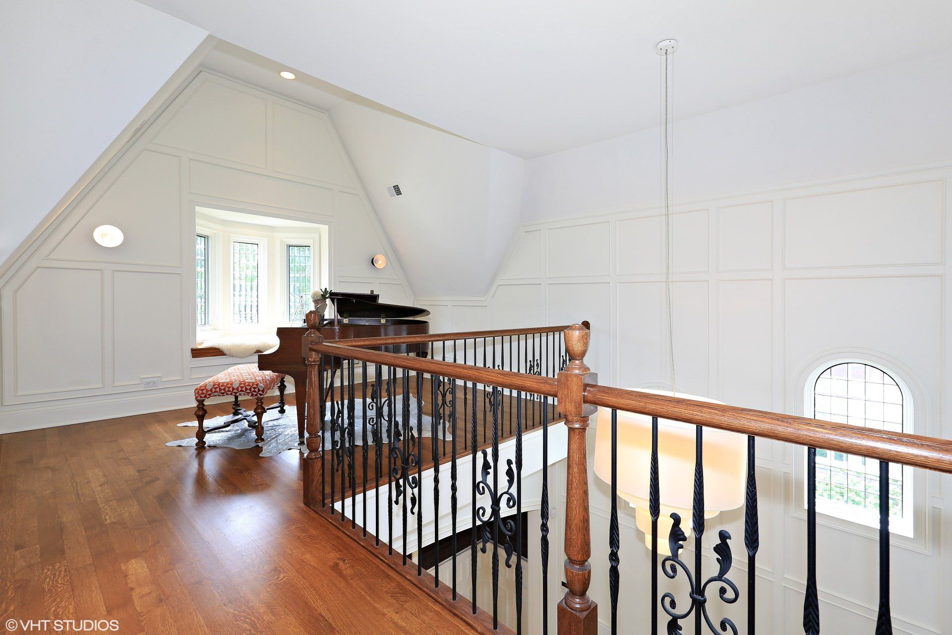 There is a piano on the second floor of the house.