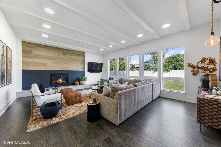A living room filled with furniture and a fireplace.