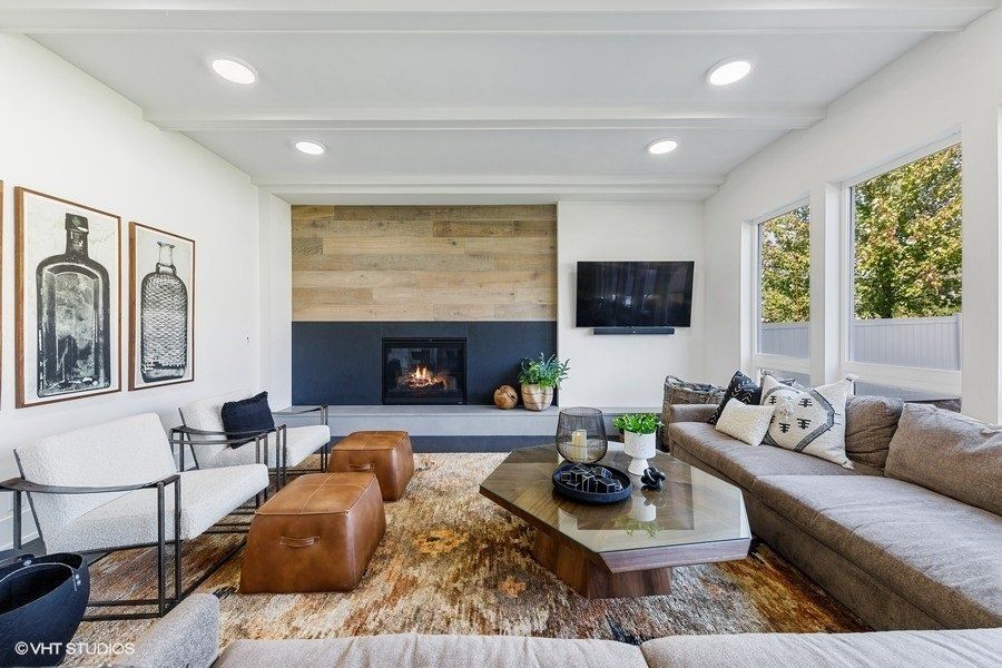 A living room filled with furniture and a fireplace.