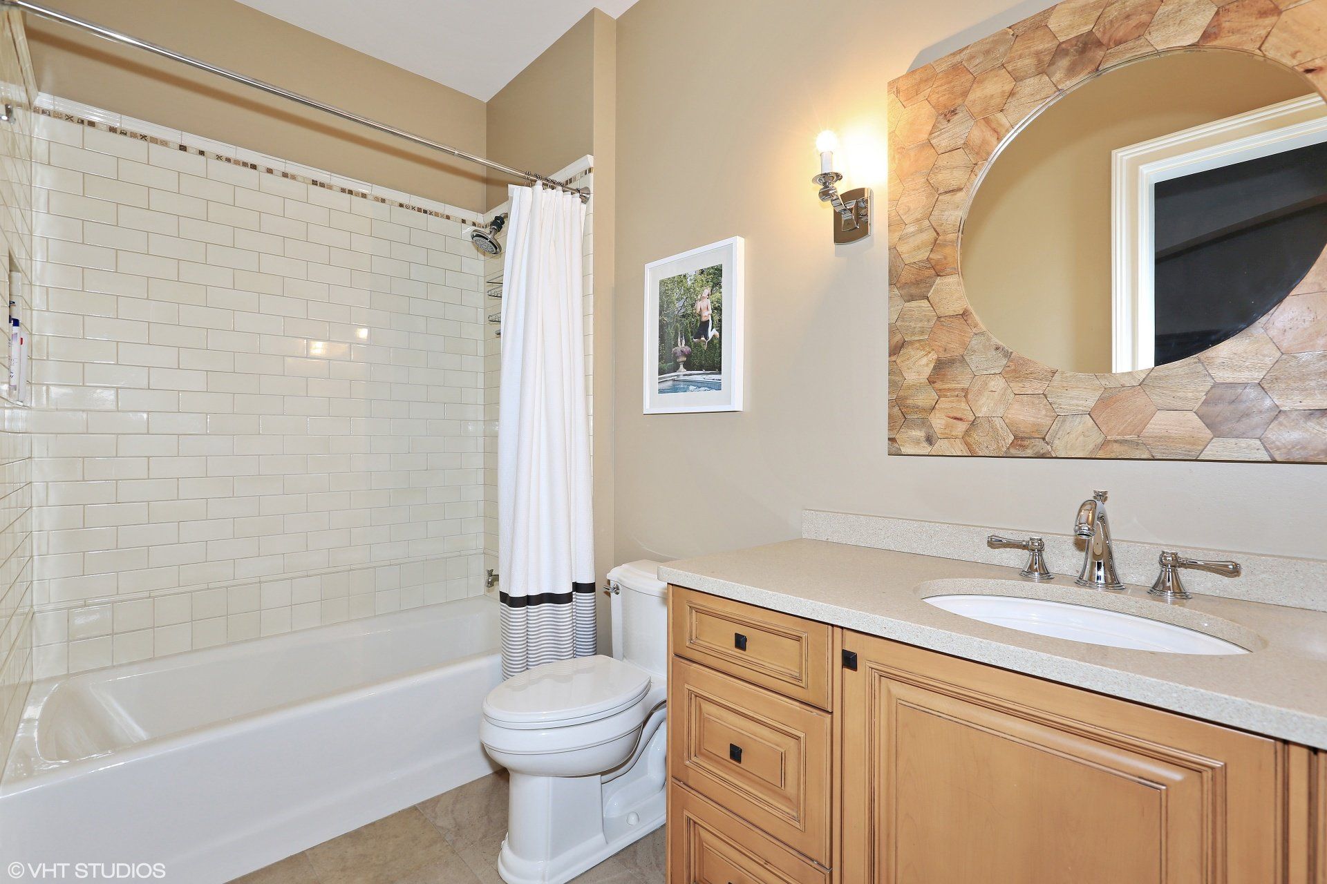 A bathroom with a toilet , sink and bathtub