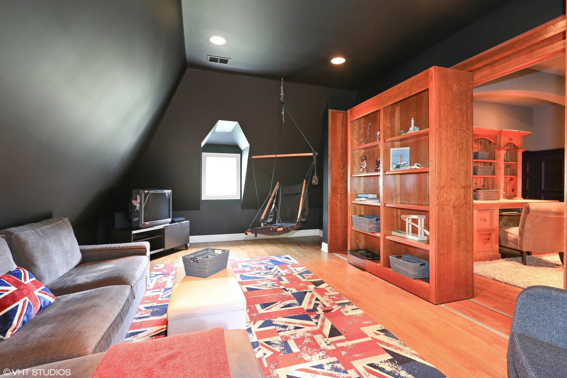 A living room with a couch and a bookshelf