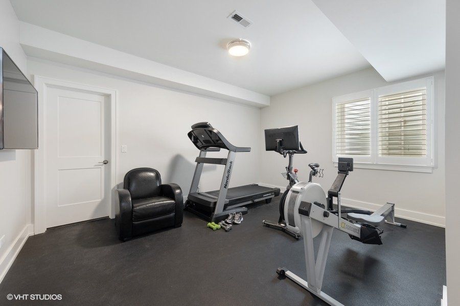 There is a treadmill and a bicycle in the room.
