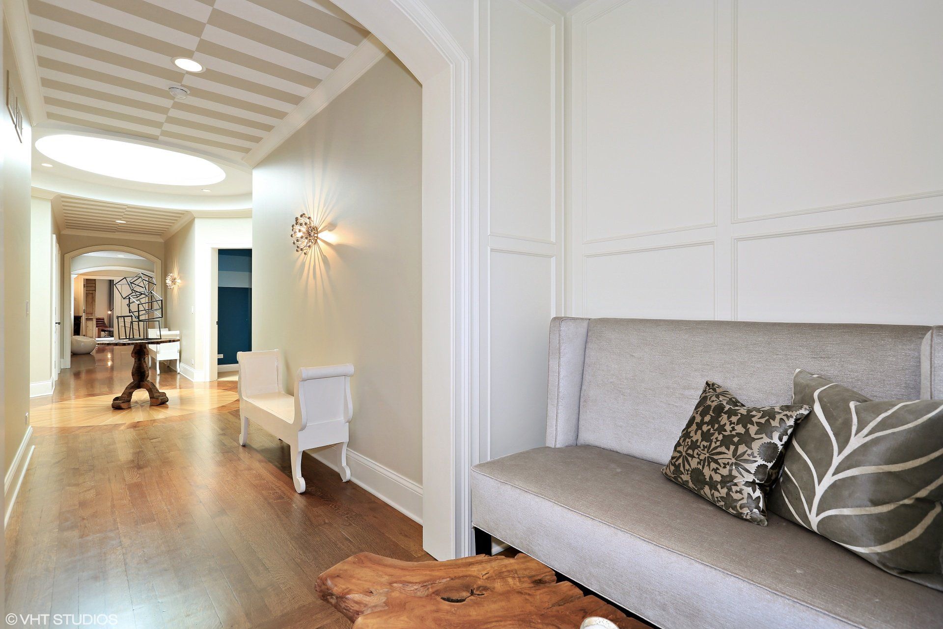 A living room with a couch and a wooden table