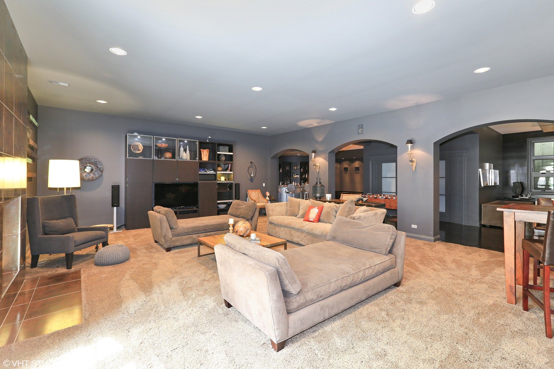 A living room with a lot of furniture and a large couch