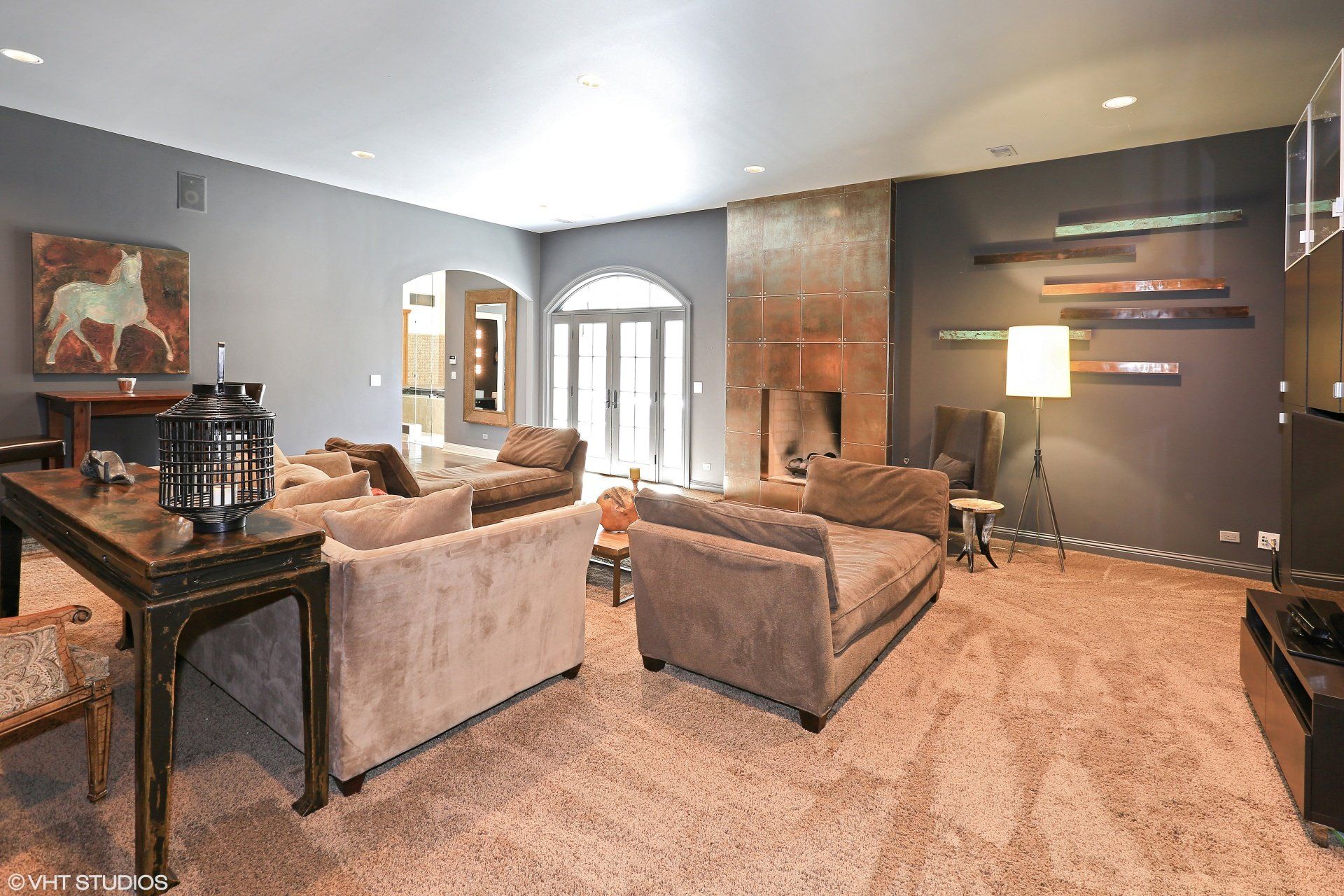 A living room with a lot of furniture and a table