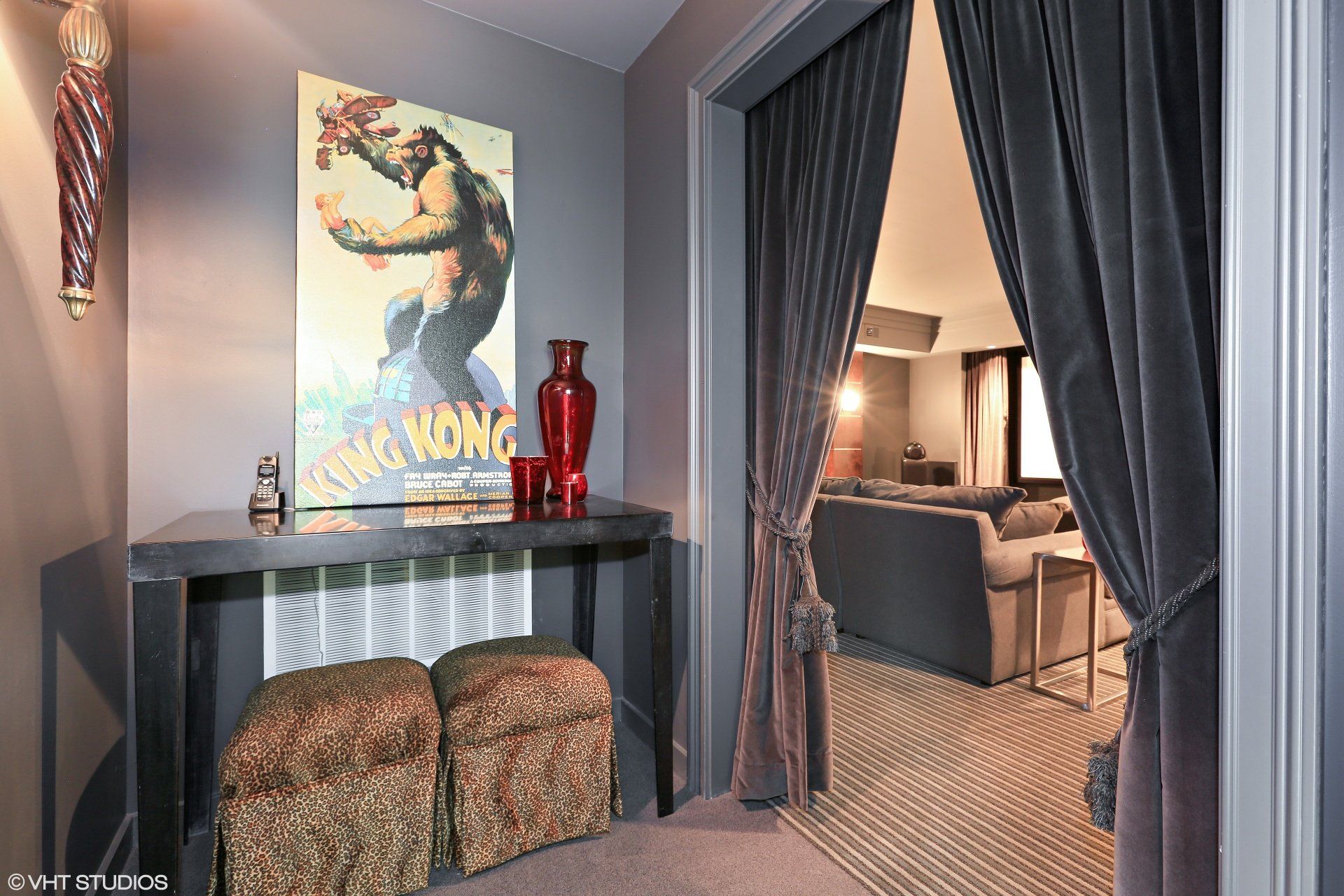A room with a king kong poster on the wall