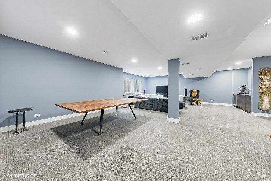 There is a table in the middle of the room.