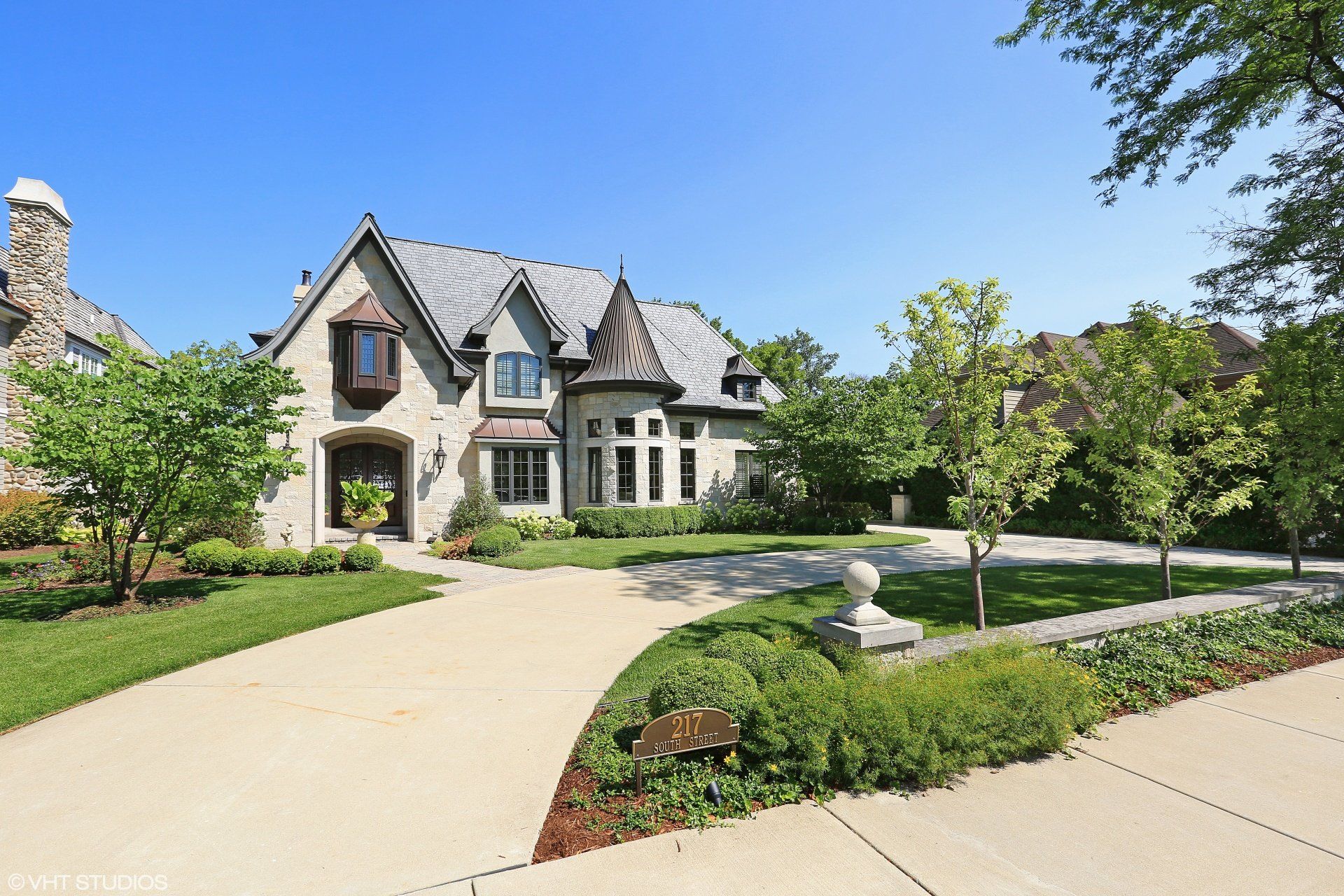 A large house with a driveway leading to it