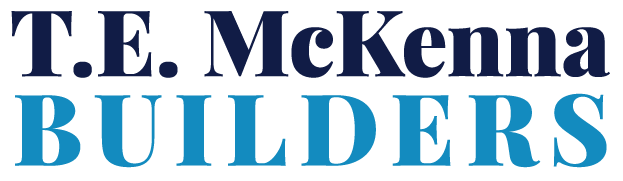 The logo for t.e. mckenna builders is blue and white.