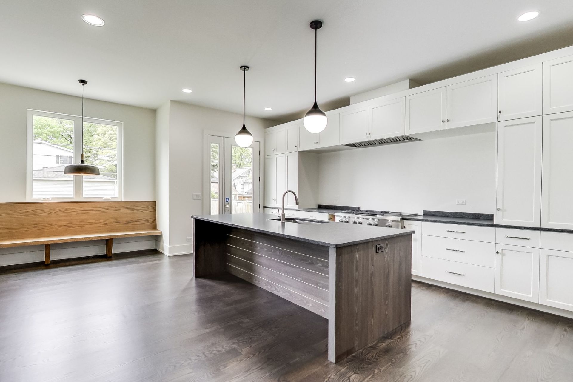There is a large island in the middle of the kitchen.