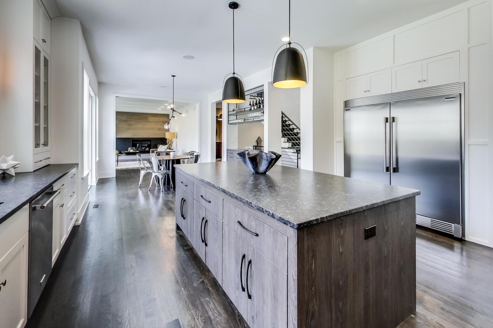There is a large island in the middle of the kitchen.
