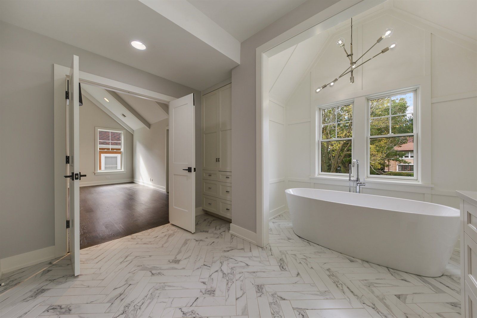 There is a bathtub in the middle of the bathroom.