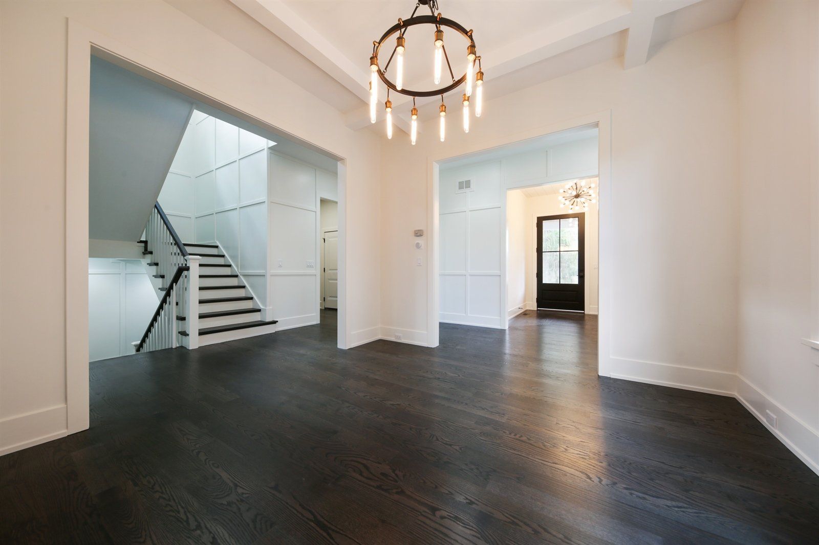 There is a chandelier in the middle of the room.