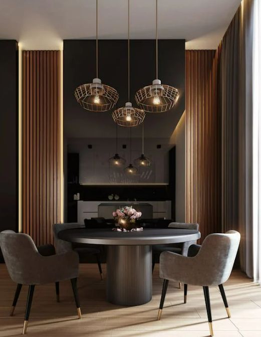 A dining room with a round table and chairs